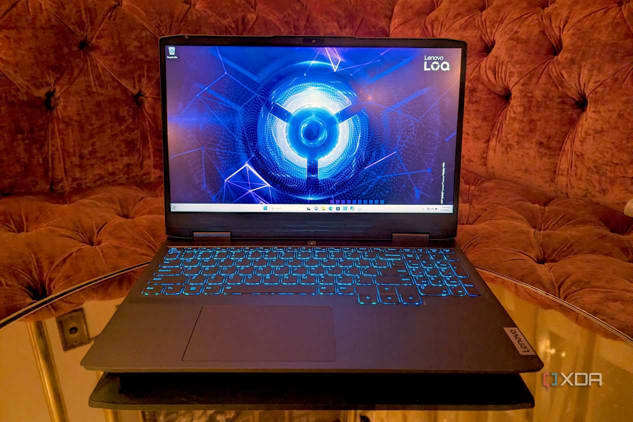 Lenovo LOQ 15 Gaming Laptop on a table in front of a sofa
