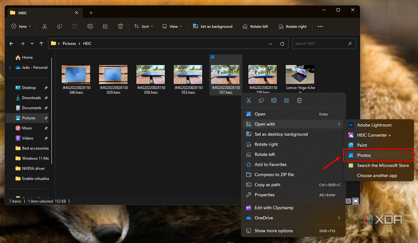 Screenshot of File Explorer with a context menu showing the option to open an HEIC file using the Photos app