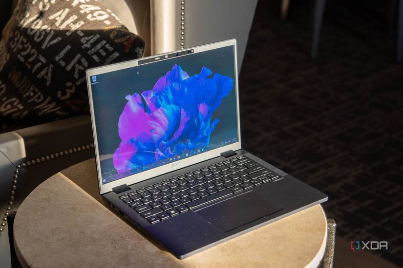 Angled view of black laptop with purple and blue colors on the screen