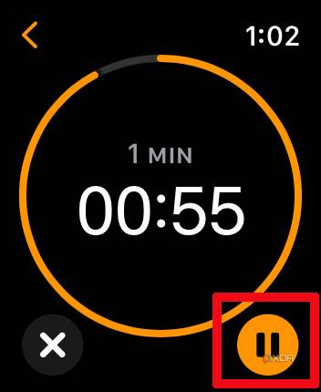 Apple Watch timer app with one minute going and the pause button selected.