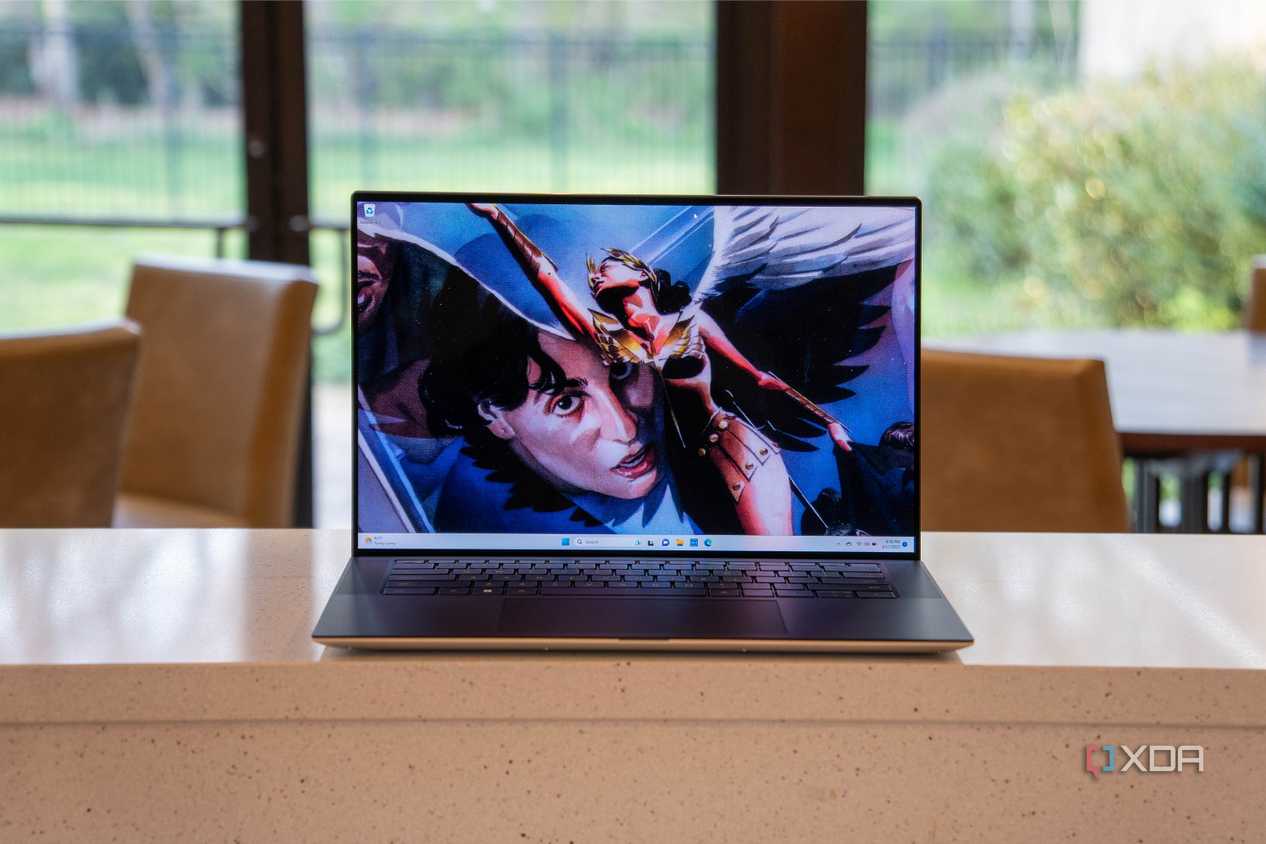 Front view of laptop with superhero on the screen