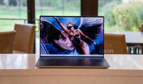 Front view of laptop with superhero on the screen