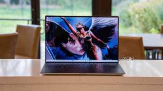 Front view of laptop with superhero on the screen