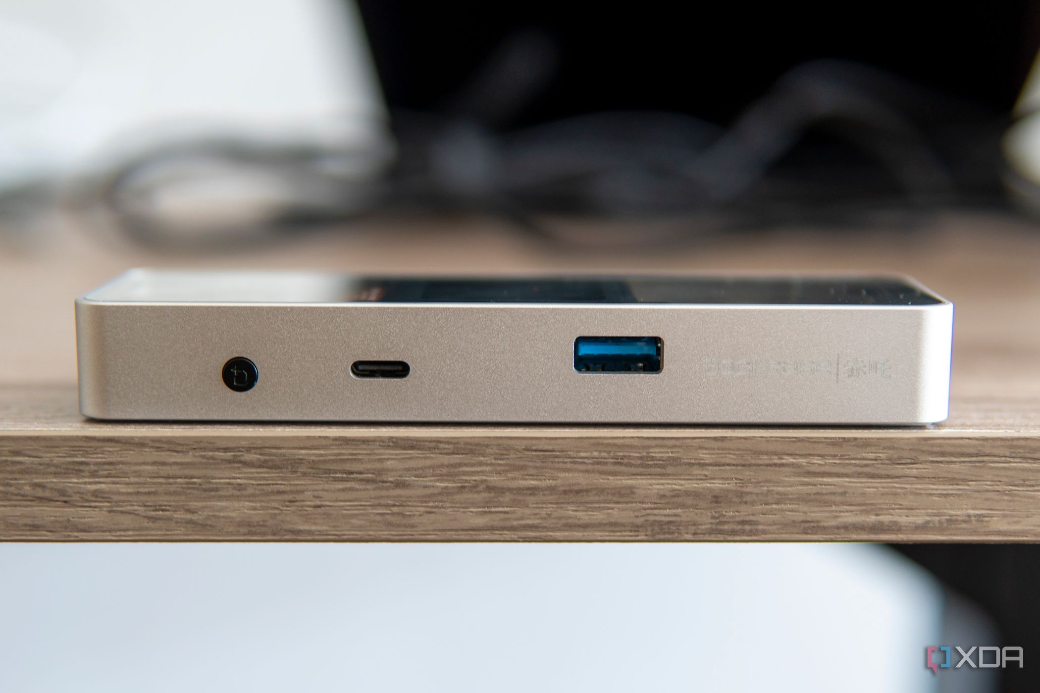 Side view of the Dockcase Pro Explorer Edition showing a button, a USB Type-C port and a USB Type-A port