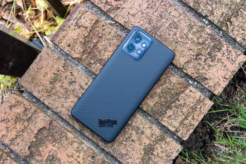 Angled view of black smartphone with ThinkPhone logo on bottom corner
