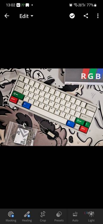 A screenshot captured on Galaxy S23 showing the Lightroom app editing an image of a keyboard.