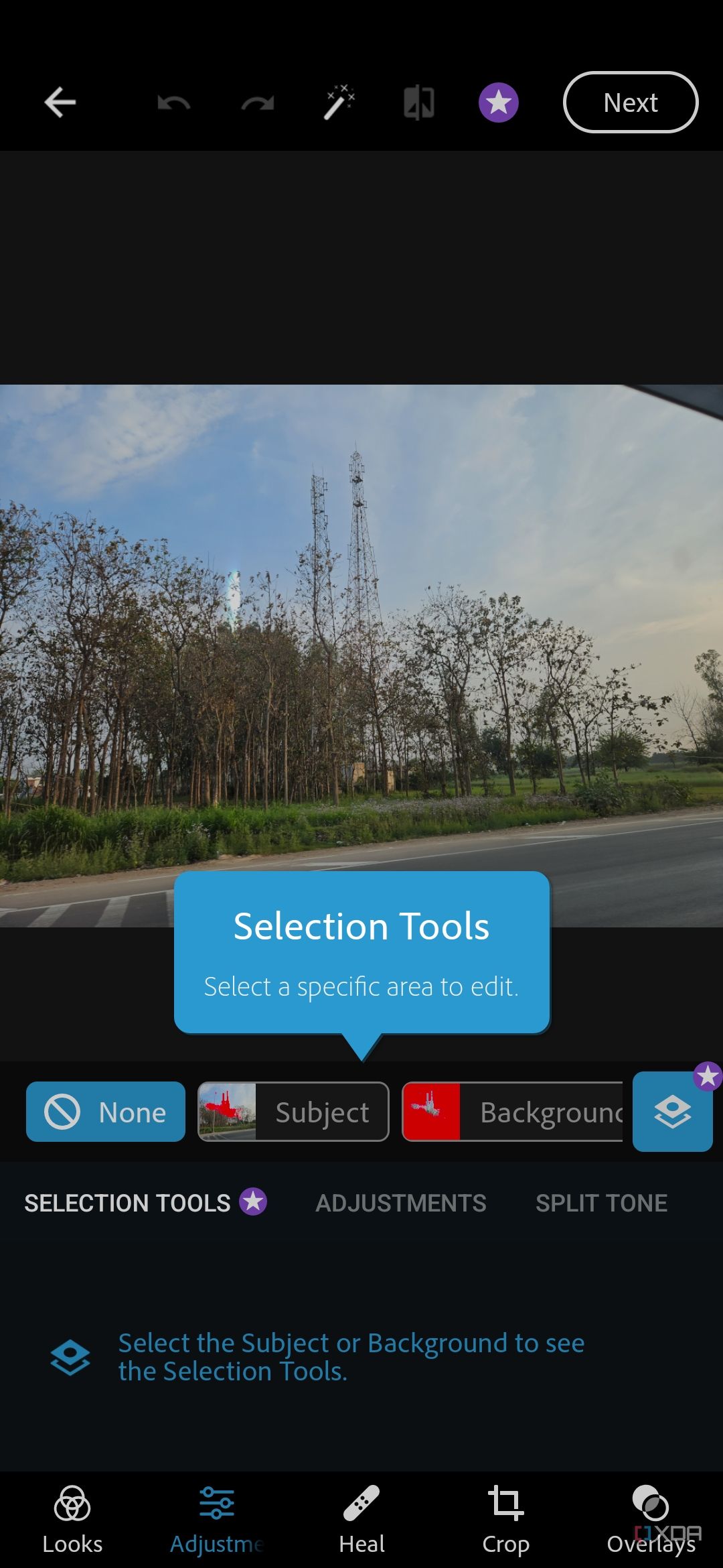 A screenshot showing an image of scenery being edited on Photoshop Express.