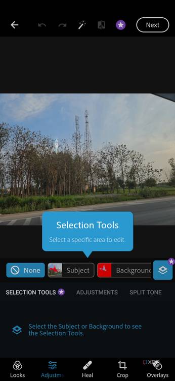 A screenshot showing an image of scenery being edited on Photoshop Express.