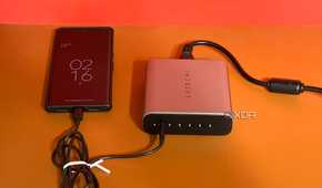 Satechi GaN 200W USB C Charger with a phone