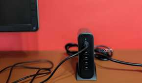 Satechi GaN 200W USB C Charger tucked next to a monitor