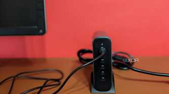 Satechi GaN 200W USB C Charger tucked next to a monitor