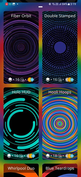 A screenshot showing a collection of spiral wallpapers over a colorful background.