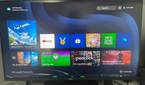 A photo of ads for games and services on Xbox Game Pass on an Xbox