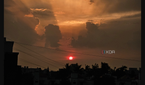 A screenshot showing an image of sunset being edited in Galaxy Enhance-X app.