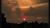 A screenshot showing an image of sunset being edited in Galaxy Enhance-X app.
