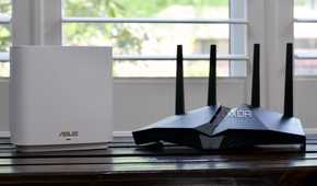 ASUS ZenWiFi ET8 router and AX82U on a bench