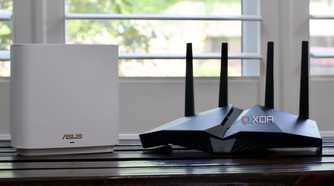 ASUS ZenWiFi ET8 router and AX82U on a bench