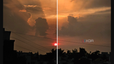 A screenshot showing an image being edited in Galaxy Enhance-X app with a highlighted download button