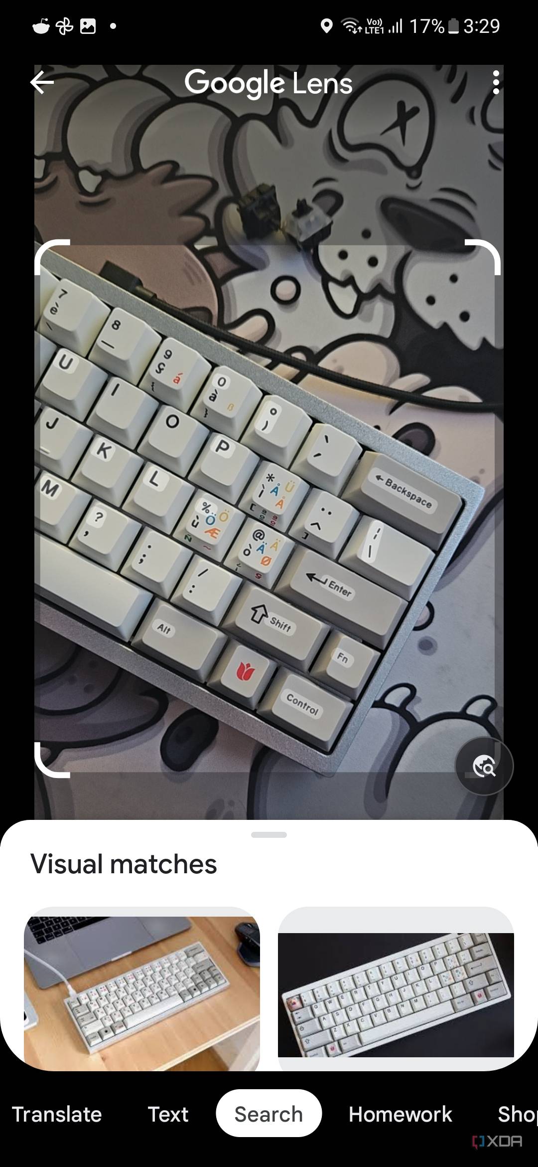A screenshot showing Google Lens app scanning a keyboard to relevant search results.
