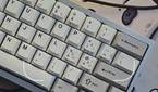 A screenshot showing the Google Lens viewfinder with a keyboard on a deskmat in frame.