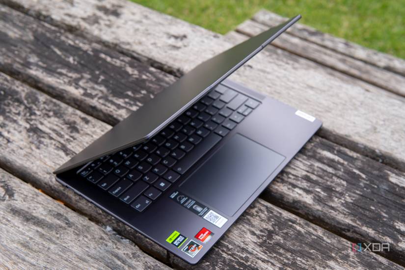 Angled view of the Lenovo Slim Pro 7 with the lid open at roughly 60 degrees and facing right