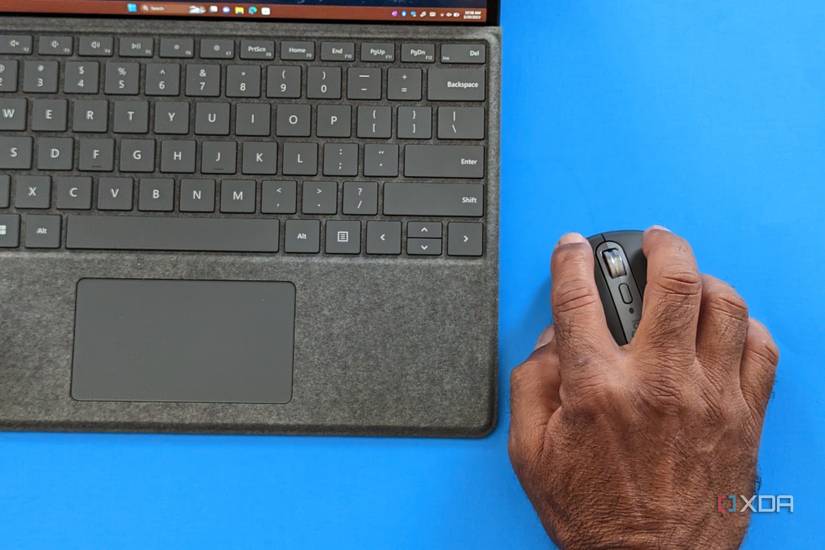 Hands holding the Logitech MX Anywhere 3S 