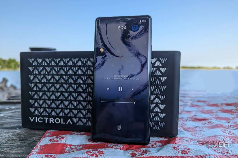 Motorola Edge+ 2023 leaning against a Bluetooth speaker