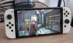 A Nintendo Switch OLED model running Resident Evil Revelations 2