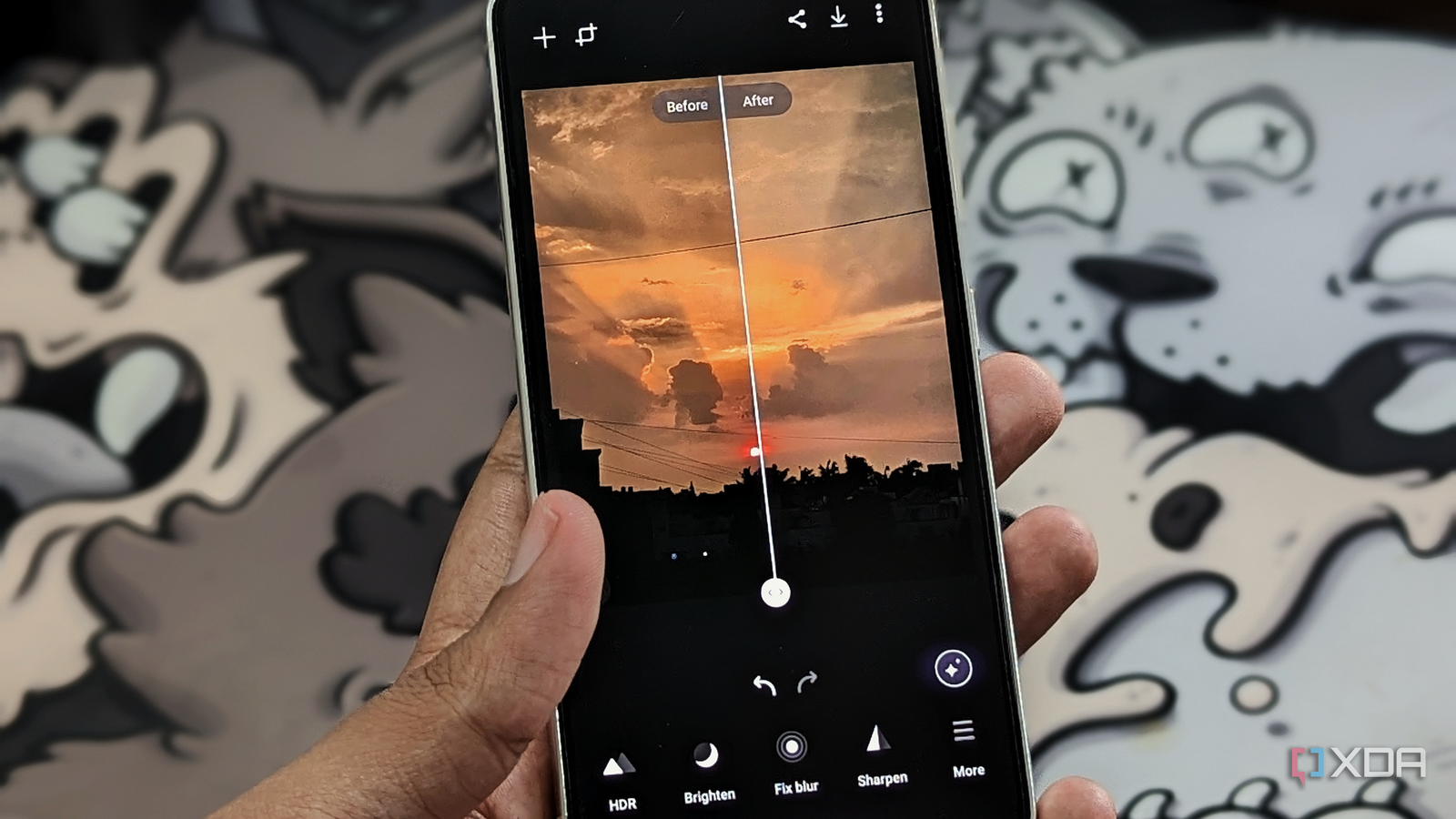 An image showing a person holding a Galaxy S23 displaying Samsung's Galaxy Enhance-X app.