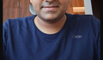 A screenshot highlighting editing tools with a selfie of a man being edited in the background.