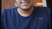 A screenshot highlighting editing tools with a selfie of a man being edited in the background.