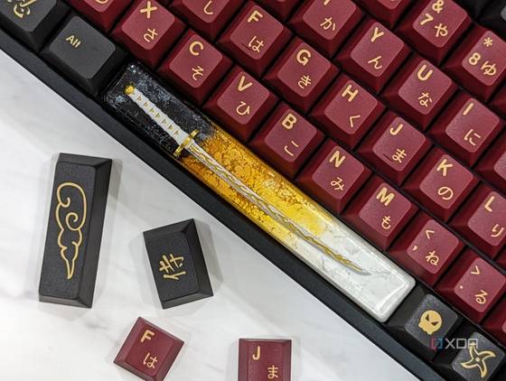 An image of a mechanical keyboard with GMK Red Samurai keycaps kept on a white marble.