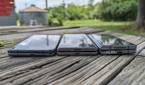 Google Pixel Fold, Tecno Phantom V Fold, and Samsung Galaxy Z Fold 4 lying flat on a table.