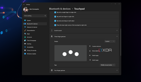 Screenshot of Windows 11 touchpad settings open over the desktop background