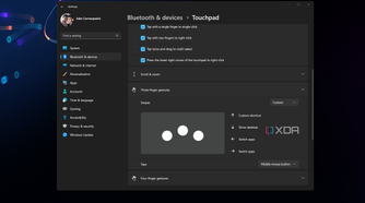 Screenshot of Windows 11 touchpad settings open over the desktop background