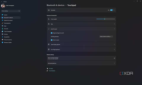 Screenshot of Windows 11 touchpad settings showing options related to scroll and zoom