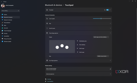 Screenshot of Windows 11 touchpad settings showing options for three-finger gestures