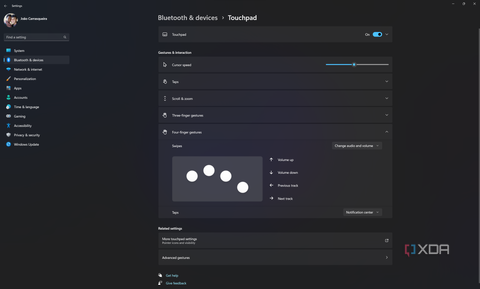 Screenshot of Windows 11 touchpad settings showing options for three-finger gestures