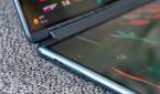 The speaker grill hidden in the Yoga Book 9i's hinge.