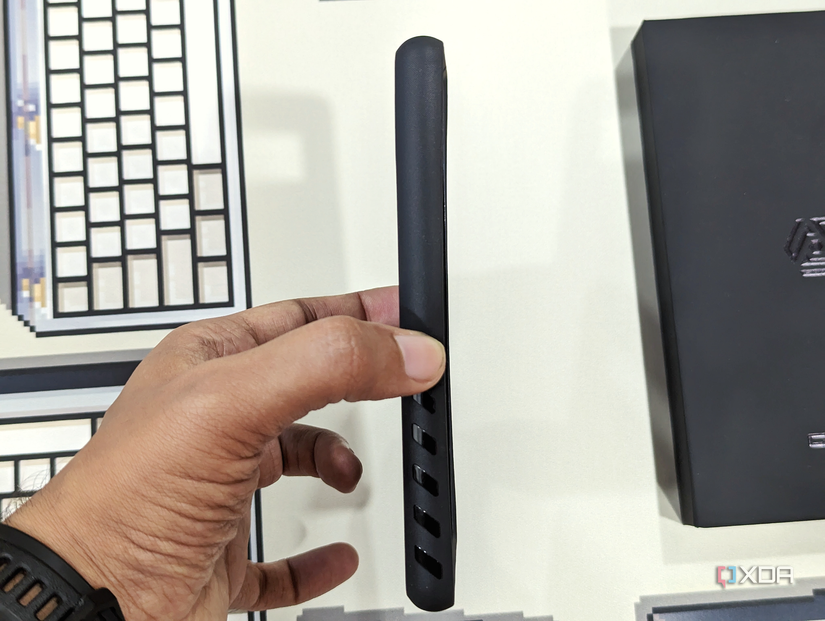 An image of a person holding Dbrand's Grip to show its side profile.