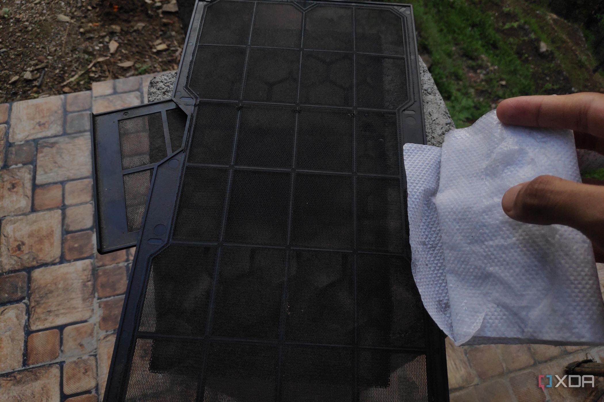 An alcohol wipe and three dust filters