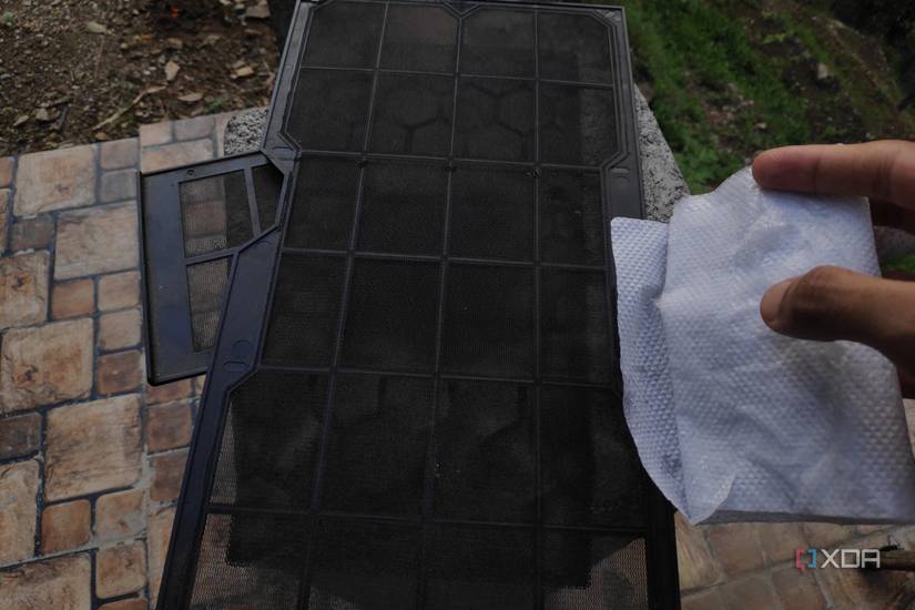 An alcohol wipe and three dust filters
