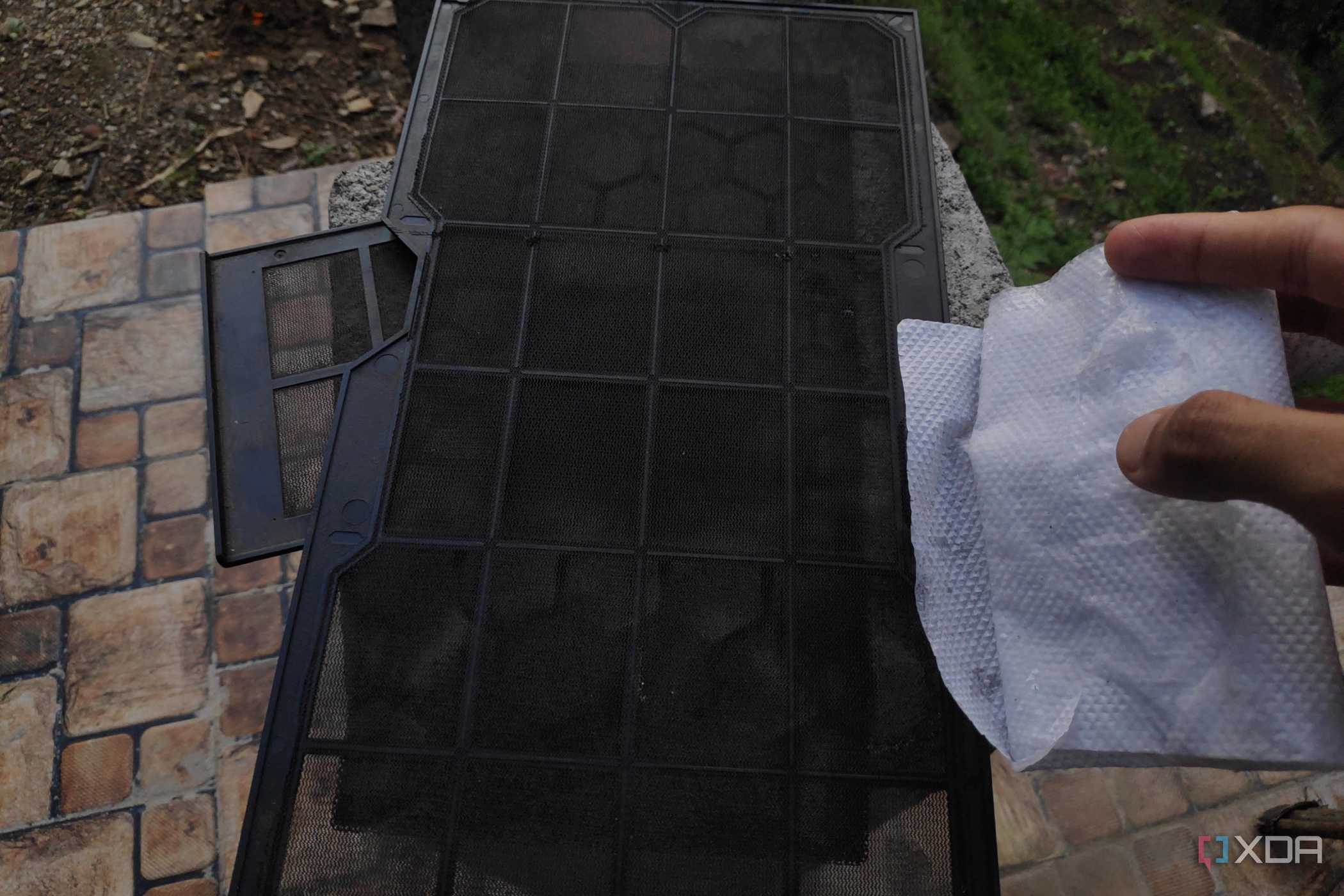 An alcohol wipe and three dust filters