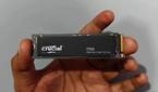 User holding the Crucial T700 SSD in hand