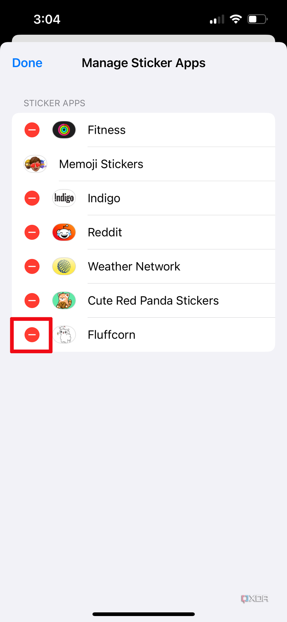 a red circle with a white line beside a sticker pack called Fluffcorn in the manage sticker apps section on iPhone