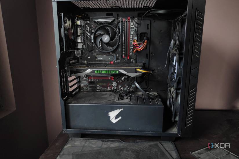 Front view of a dusty PC along with its dust filters