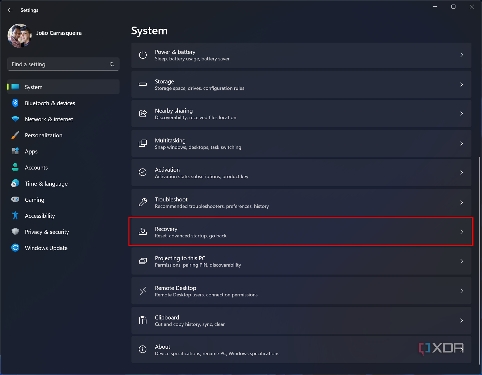 Screenshot of the System section in the Windows 11 Settings app with the recovery button highlighted
