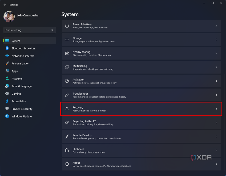 Screenshot of the System section in the Windows 11 Settings app with the recovery button highlighted