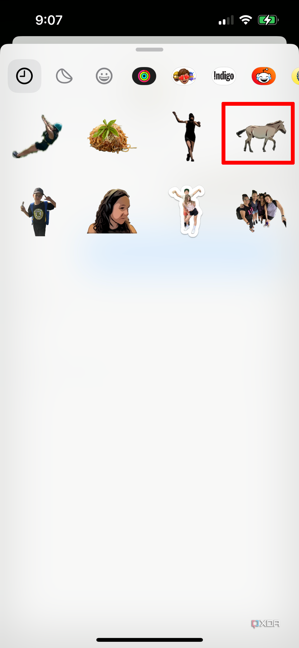 The Sticker Drawer on iPhone showing various custom stickers.