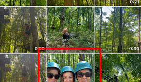 A photo library page on an iPhone with an image of three women wearing headgear selected.